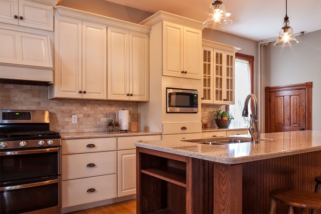 light colored kitchen cabinet with medium colored floor