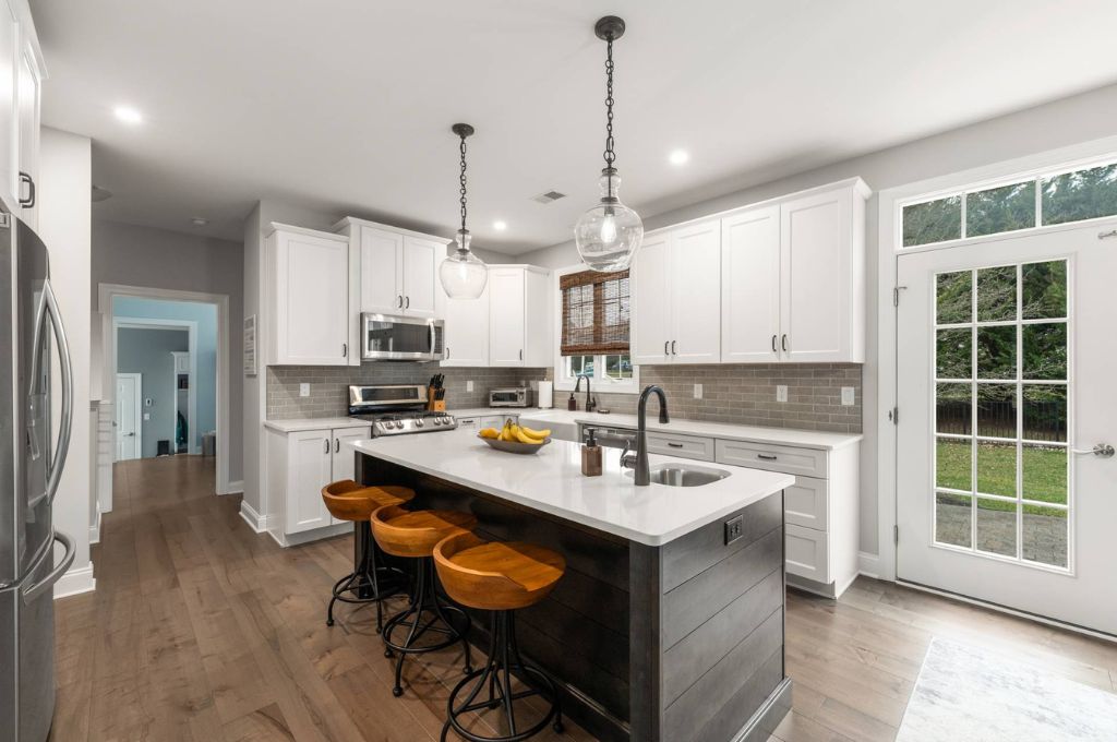 white countertop with black base kitchen island plan